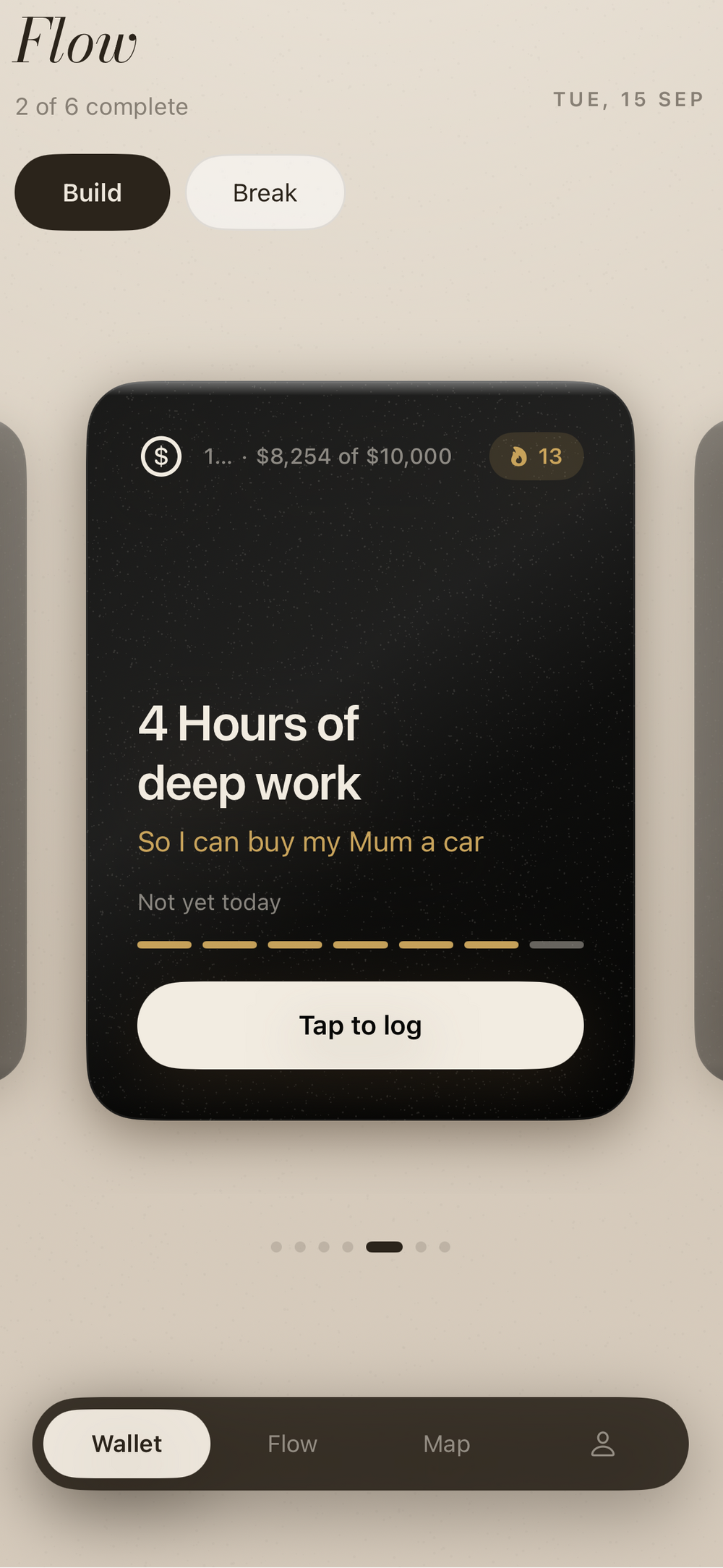 Sitting on the edge of the bed, a habit card open on the phone, the Flow on the bedside table