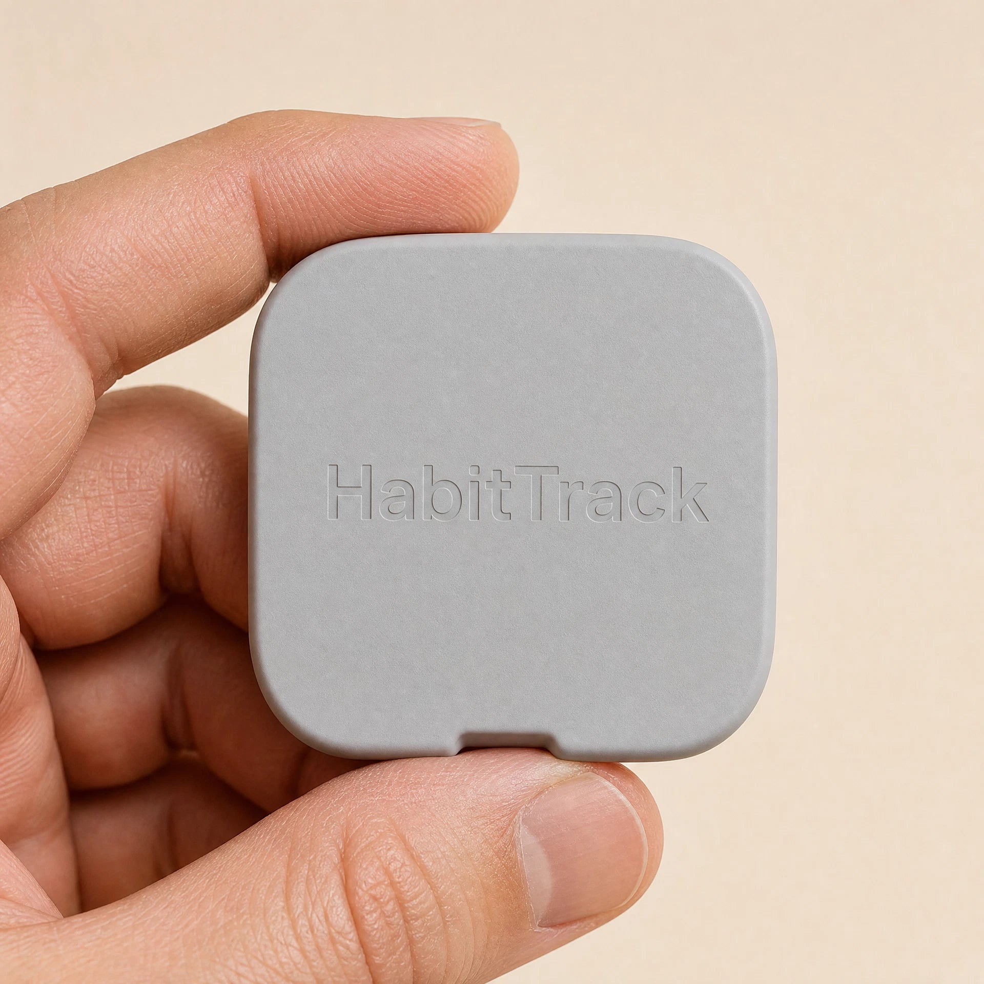 HabitTrack device held in hand